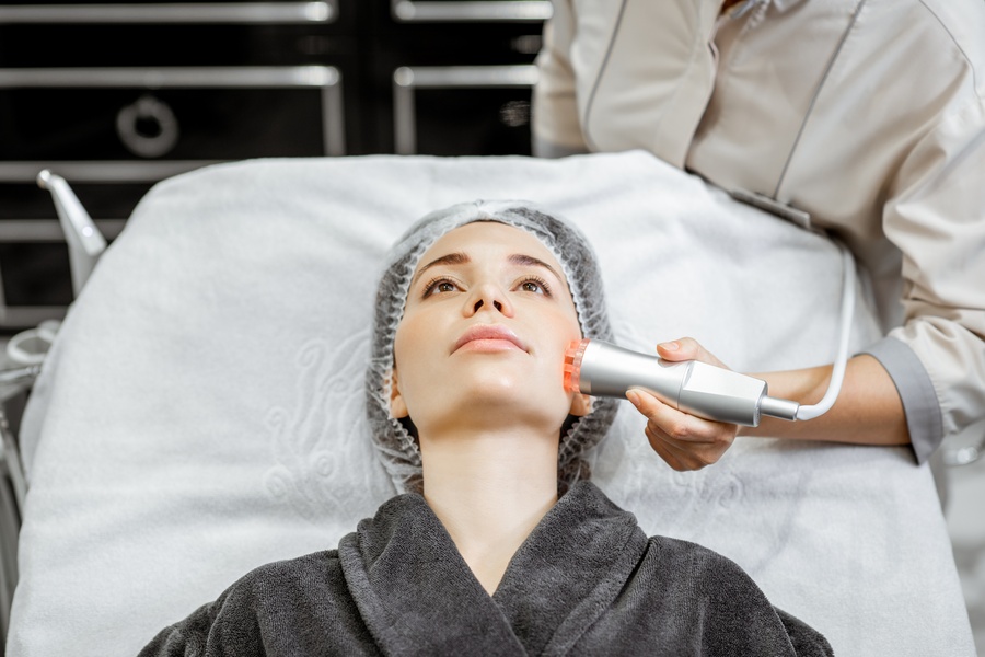 Cosmetologist Making Facial Treatment To A Woman