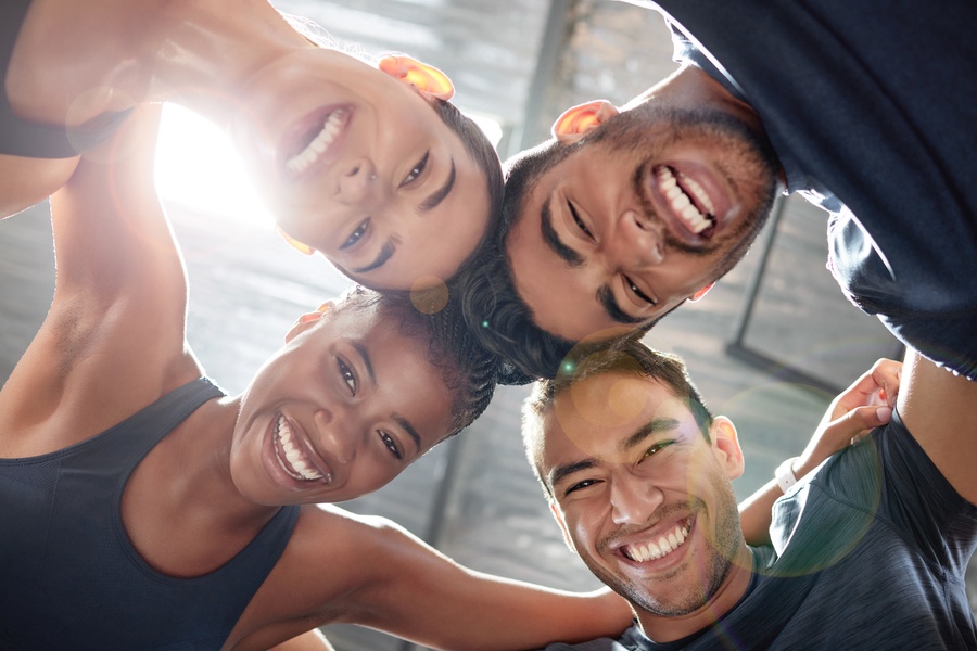 Fitness Workout And Exercise Group Huddle And